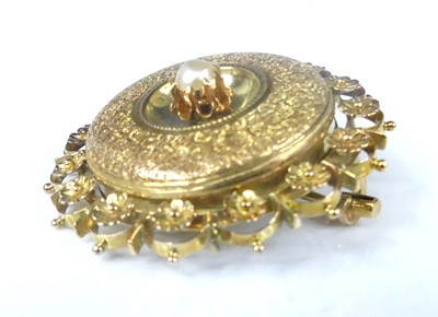 Lot 2567 - A yellow metal target brooch, comprising a...