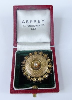 Lot 2567 - A yellow metal target brooch, comprising a...