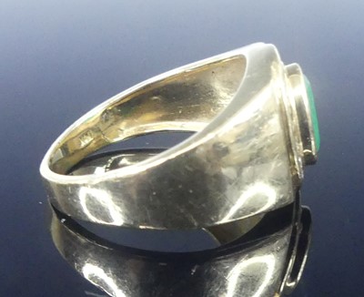 Lot 2568 - A yellow metal, emerald and diamond signet...