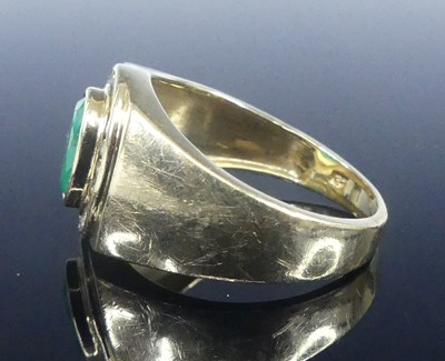 Lot 2568 - A yellow metal, emerald and diamond signet...