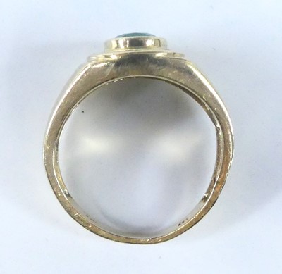 Lot 2568 - A yellow metal, emerald and diamond signet...
