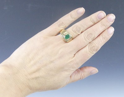Lot 2568 - A yellow metal, emerald and diamond signet...