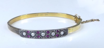 Lot 2572 - A yellow and white metal hinged hollow oval...