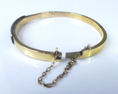 Lot 2572 - A yellow and white metal hinged hollow oval...
