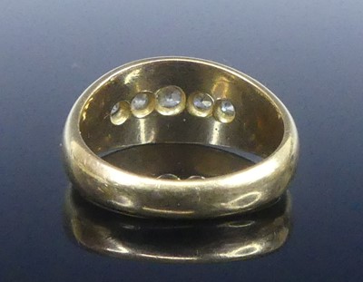 Lot 2573 - An 18ct yellow gold diamond half eternity ring,...