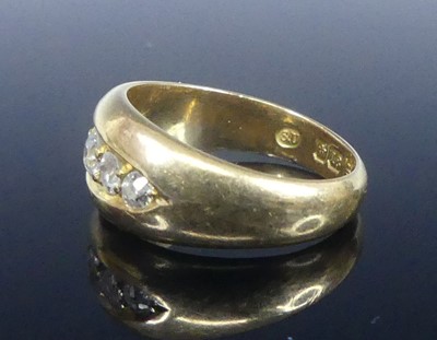 Lot 2573 - An 18ct yellow gold diamond half eternity ring,...