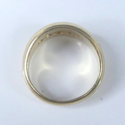 Lot 2573 - An 18ct yellow gold diamond half eternity ring,...