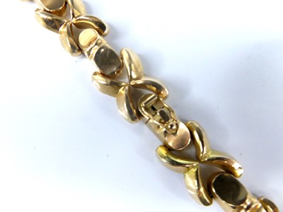 Lot 2576 - A yellow metal hollow cross and bar link...