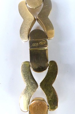 Lot 2576 - A yellow metal hollow cross and bar link...