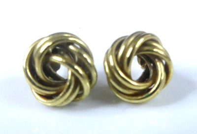 Lot 2579 - A pair of yellow metal double-strand knot stud...