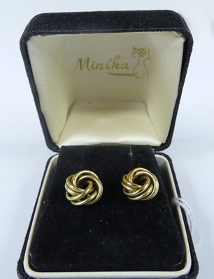 Lot 2579 - A pair of yellow metal double-strand knot stud...
