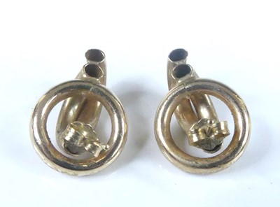 Lot 2581 - A pair of yellow metal hollow multi-circular...