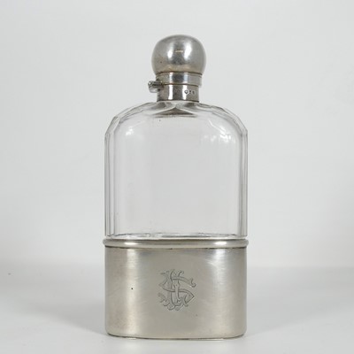 Lot 286 - A Victorian hip flask, having a silver cover...