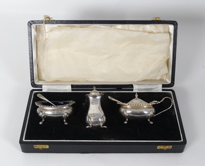 Lot 276 - An Elizabeth II silver three piece cruet set,...