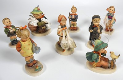 Lot 220 - A collection of eight Hummel figures