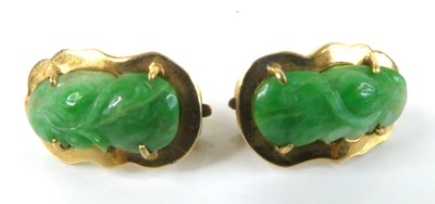 Lot 2586 - A yellow metal carved jadeite pendant and...