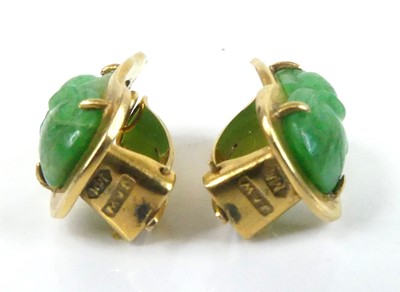 Lot 2586 - A yellow metal carved jadeite pendant and...