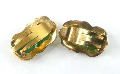Lot 2586 - A yellow metal carved jadeite pendant and...