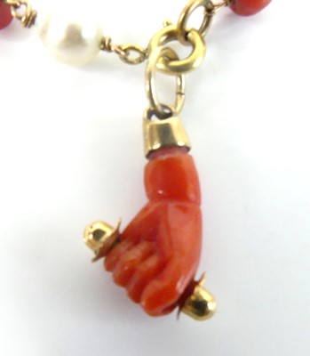 Lot 2589 - A yellow metal, coral and freshwater pearl...