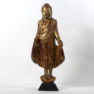 Lot 2 - A gilt painted carved wooden figure of a...