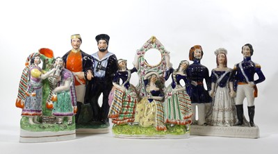 Lot 4 - A group of Staffordshire pottery figures, to...