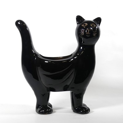 Lot 26 - A black glazed pottery planter in the form of...