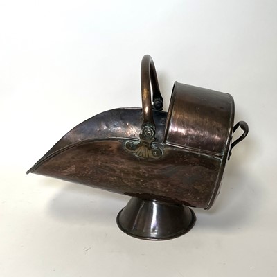 Lot 68 - A Victorian helmet shaped copper coal scuttle