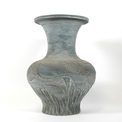 Lot 111 - A grey painted scraffito decorated terracotta...