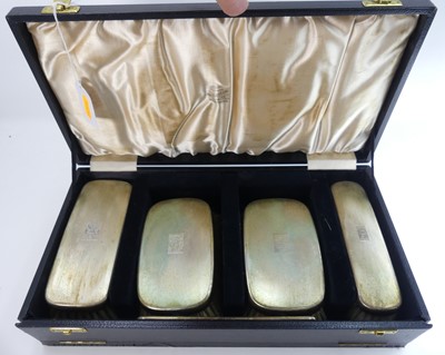 Lot 299 - A set of four George VI silver-backed clothes...