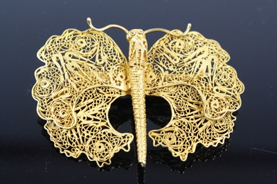 Lot 306 - A yellow metal filigree worked butterfly...