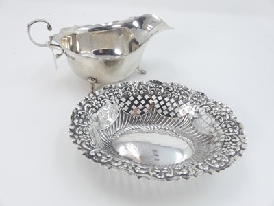 Lot 437 - An Edwardian silver sauceboat, having a wavy...