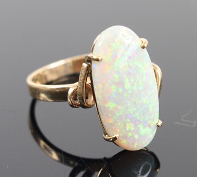 Lot 327 - A yellow metal opal dress ring, the four-claw...