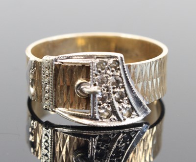 Lot 336 - A modern 9ct yellow and white gold belt ring,...