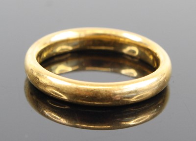 Lot 337 - A 22ct gold court shaped wedding band, sponsor...