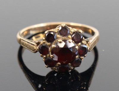 Lot 352 - A 9ct gold garnet set flower head cluster ring,...