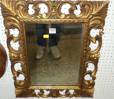 Lot 1154 - A pierced floral gilt framed rectangular wall...