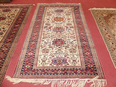 Lot 1157 - A pair of Persian woollen cream ground Ardabil...