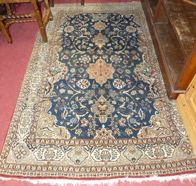 Lot 1162 - A Persian woollen blue ground Qum rug, 210 x...