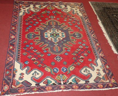 Lot 1171 - A Turkish woollen red ground Kazak rug, 200 x...