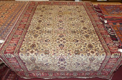 Lot 1173 - A Persian woollen cream ground Keshan rug,...