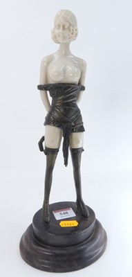 Lot 548 - An Art Deco style figure of a semi-nude lady,...