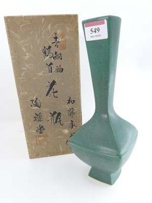 Lot 549 - A Japanese green glazed vase, having a square...