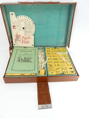 Lot 553 - A Chad Valley mah-jong set in leather case,...