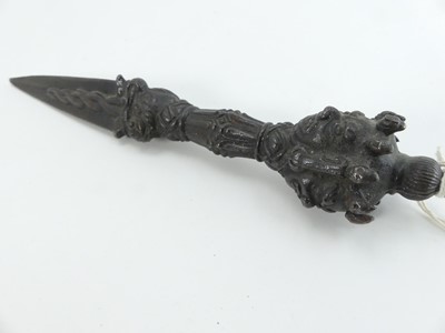 Lot 552 - A Tibetan cast iron ritual(?) dagger, having a...