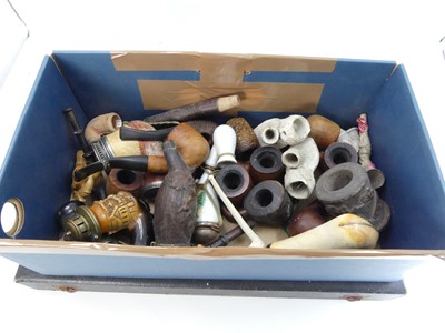 Lot 557 - A collection of assorted smoking pipes and...