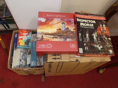 Lot 579 - A large collection of jigsaw puzzles, not...