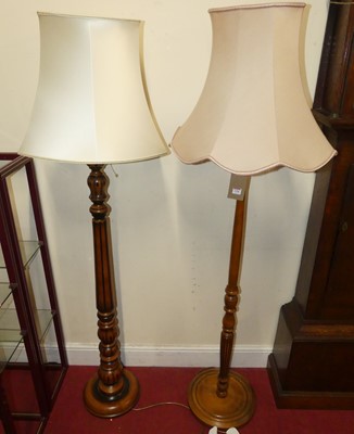 Lot 1196 - Two contemporary cherrywood turned standard lamps