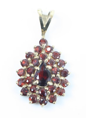 Lot 369 - A 9ct gold garnet set pendant, on 9ct gold...