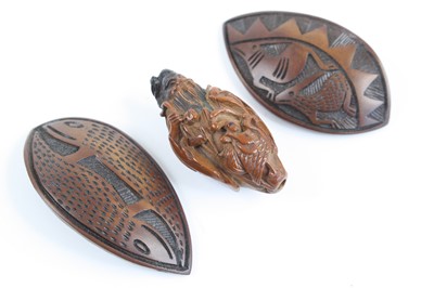 Lot 400 - A Japanese carved hardwood netsuke, 20th...