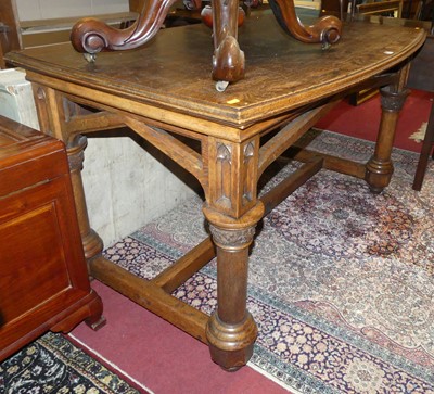 Lot 1239 - An ecclesiastical oak bow front side table,...